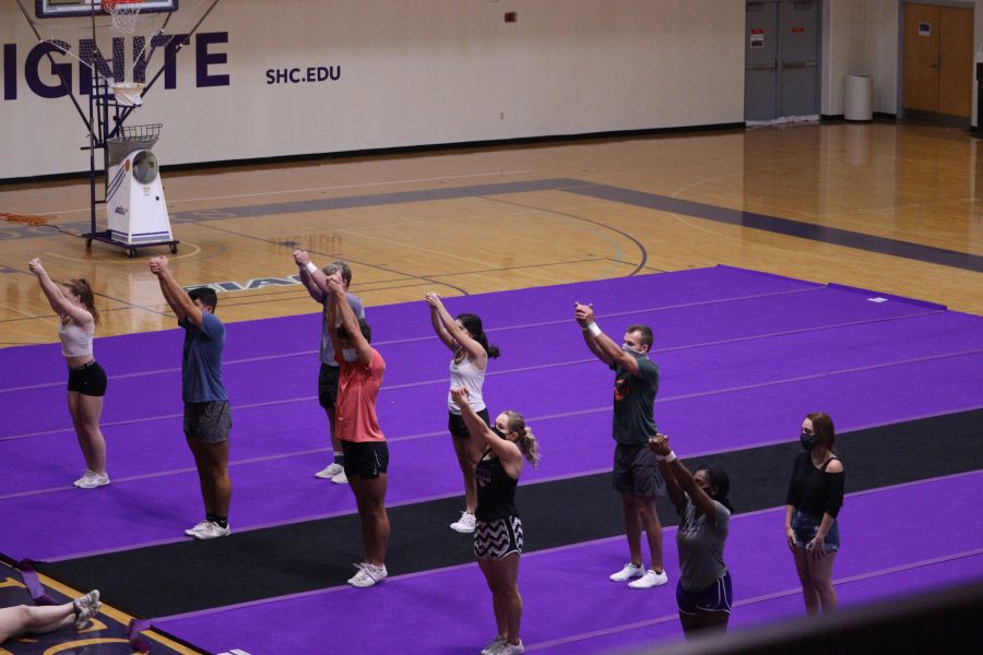 The Spring Hill College cheerleading team holds a safety-compliant practice in the gym.  