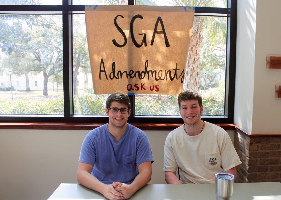 SGA+members+Ryan+Ankerson+and+Adam+Schmitt+sit+at+the+back+of+the+student+center+to+answer+questions.