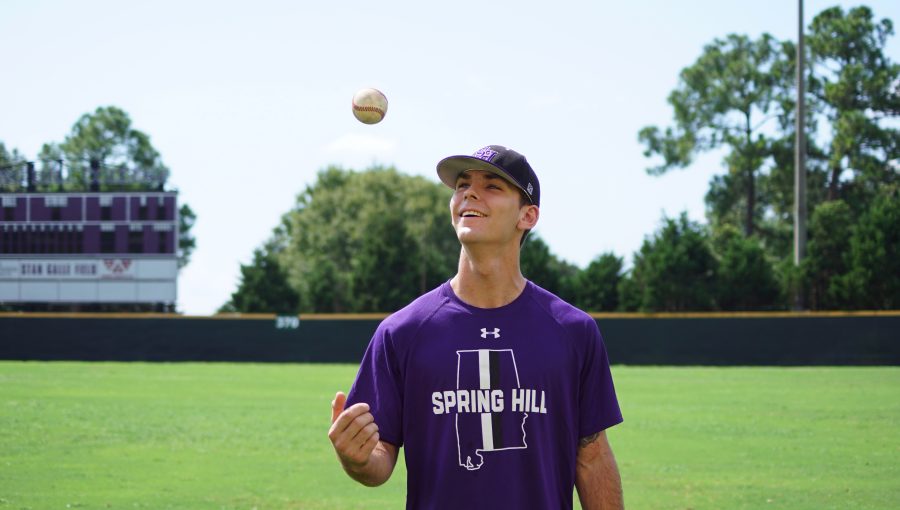 Pitcher Christian Long tosses a baseball before practice.