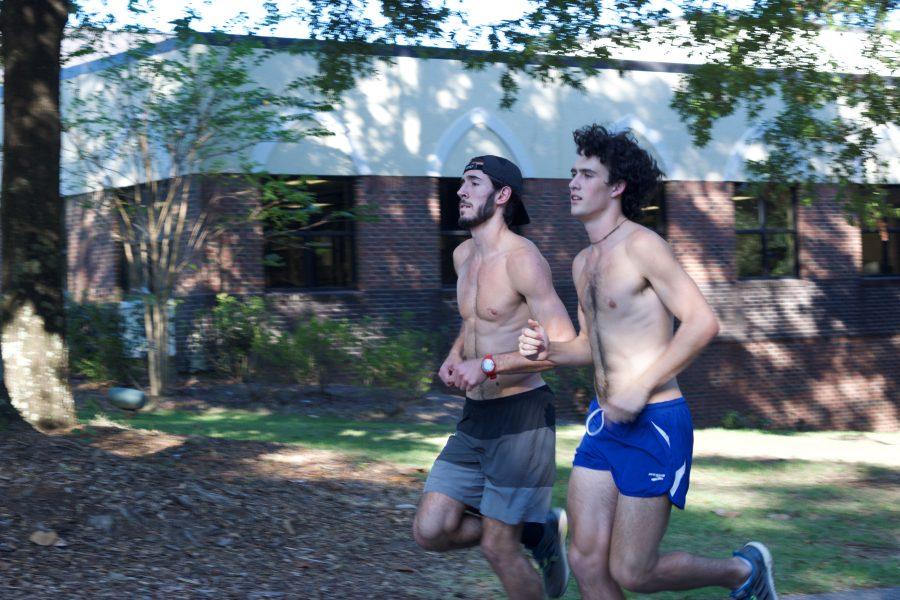 SHCs cross country team members David Toupes, left, and Spencer Albright, right, run the hill during a recent practice.