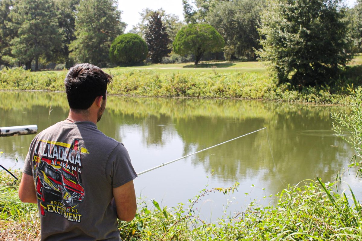 Eric Andersen spends free time fishing at a pond.
