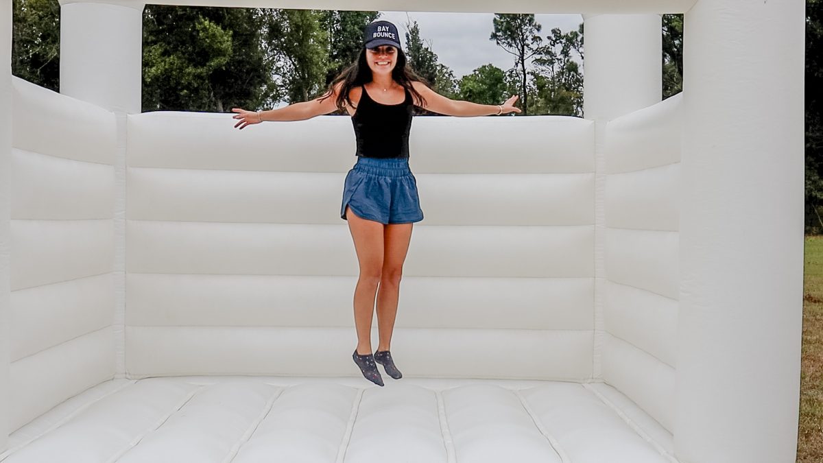 Marianna Jordan showcasing an inflatable rental. 