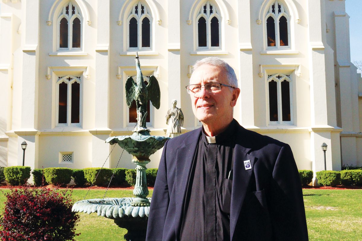 Father Bob reflects behind St. Joseph's Chapel