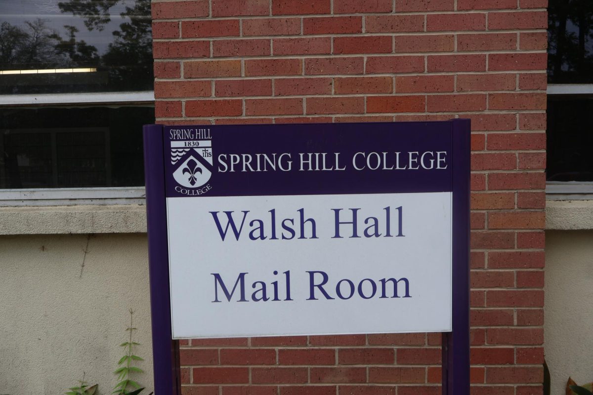Walsh Hall and th Mail Room sign outside of the two buildings