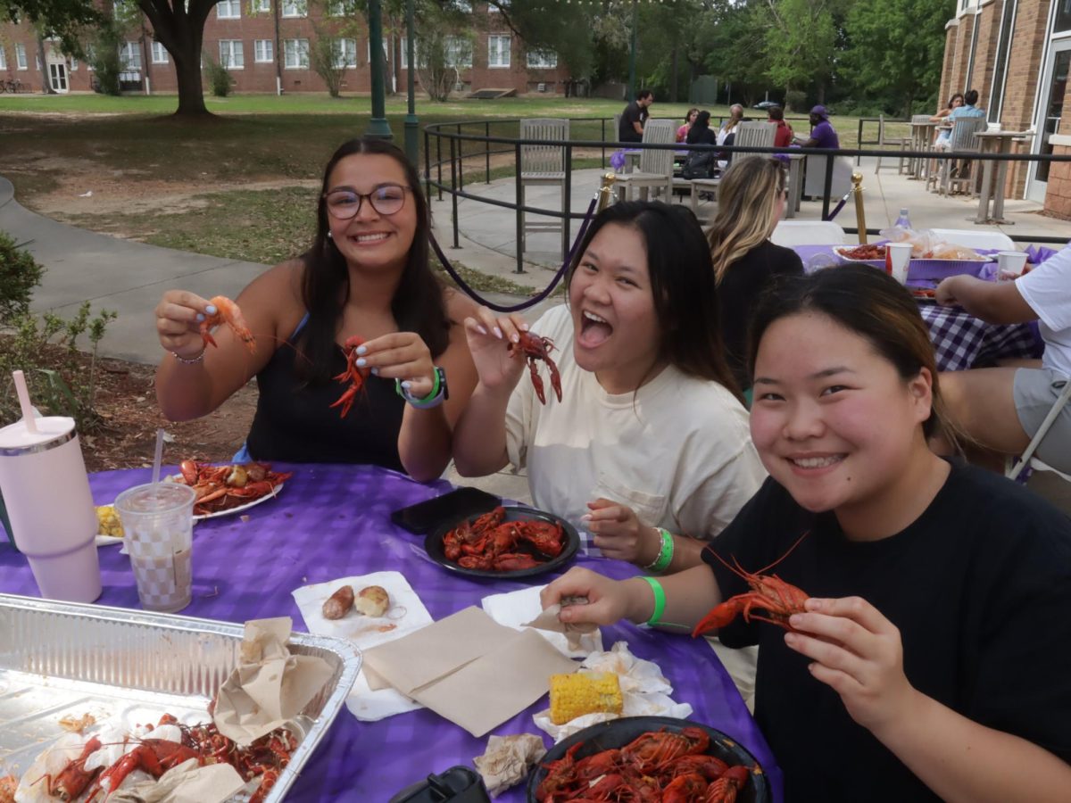Students enjoying crawfish at CPBs sixth annual Seafood Boil